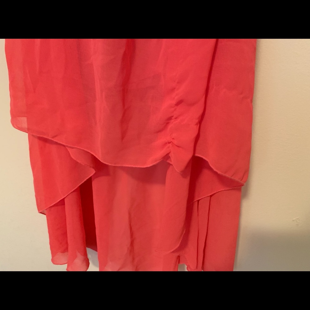 A salmon/pink layered skirt.